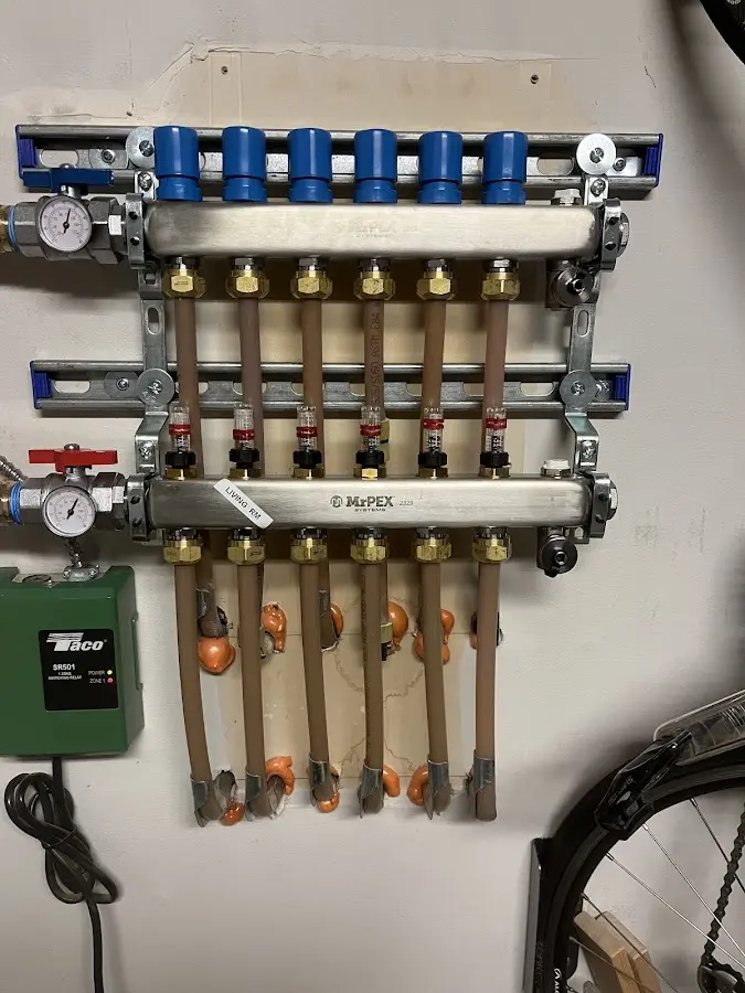 Plumber performing Water Heater Repair at a residential property in The Village of Indian Hill